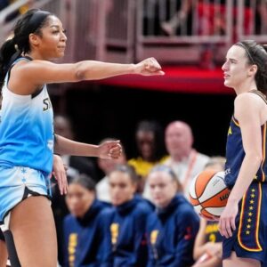 Angel Reese and Caitlin Clark react during game.